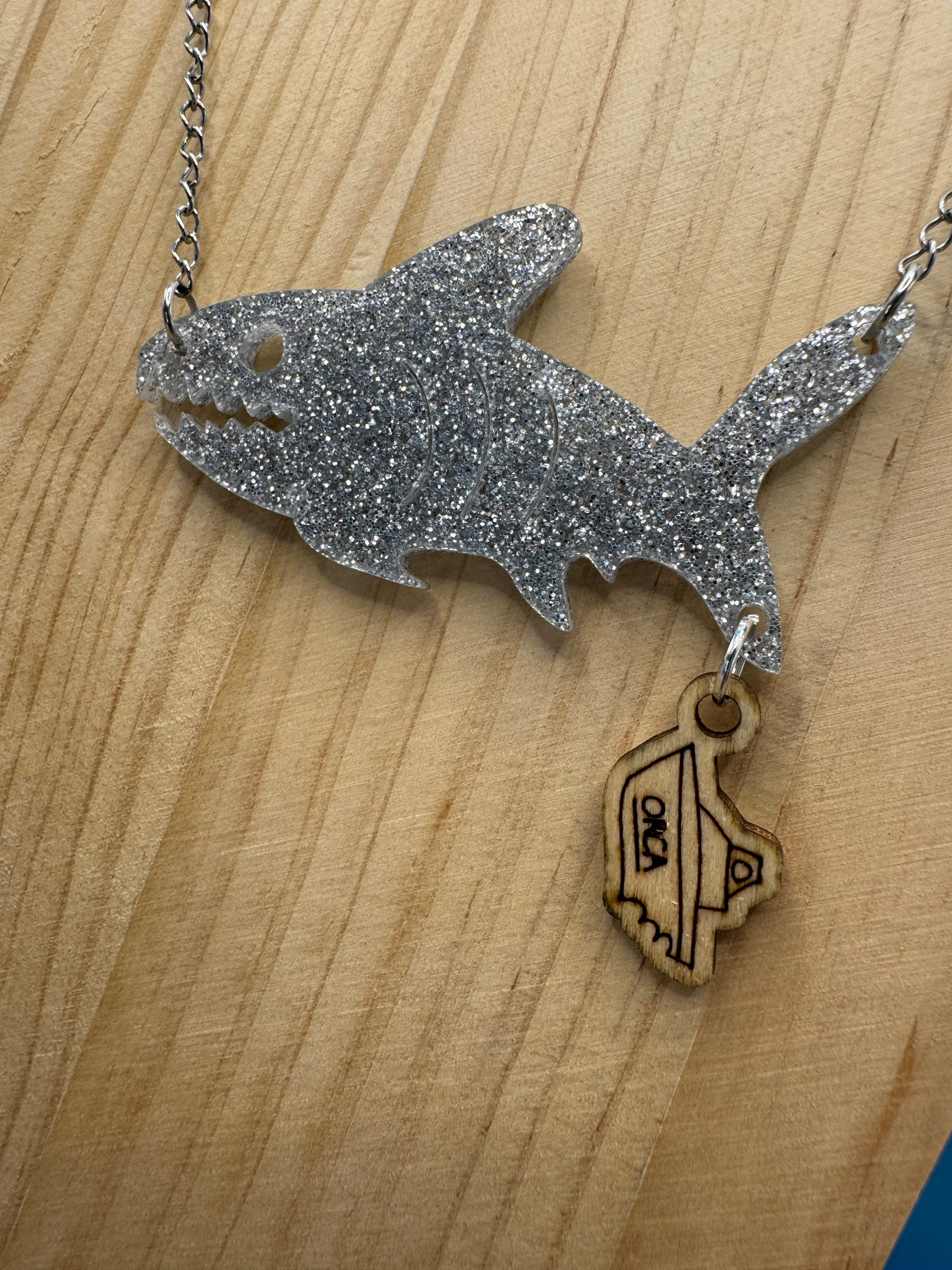 Bruce and The Orca - hand drawn, laser cut, wood and acrylic necklace