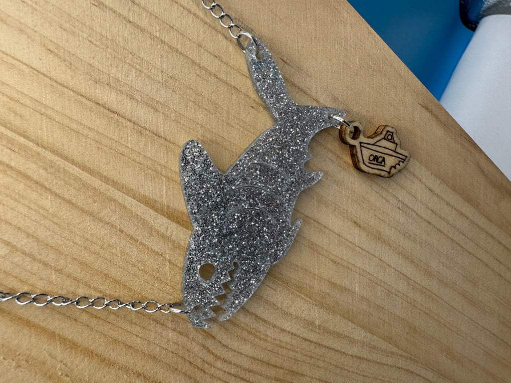 Bruce and The Orca - hand drawn, laser cut, wood and acrylic necklace